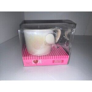 Iridescent mug with spoon